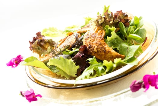 Roasted chicken with lettuce on a plate