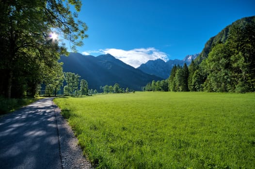 Beautiful landscape with high mountains and rising sun