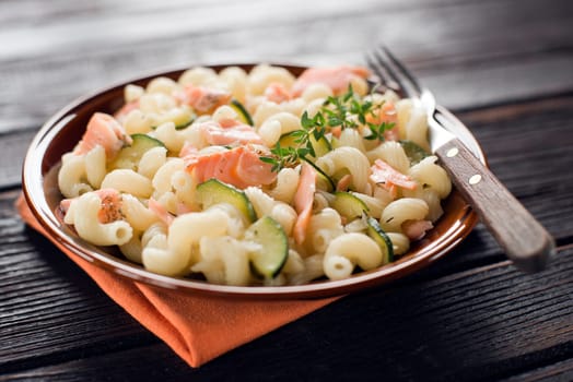 Fresh pasta with smoked salmon with zucchini