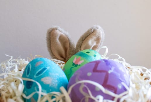 Easter eggs , flowers and funny bunny to celebrate Easter holidays and splring. Space for copy.Wallpaper for Easter announcements and cards.Horizontal real picture