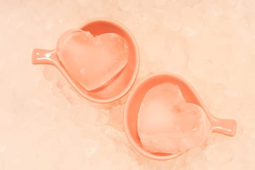 Heart ice in pink cups with ice texture background