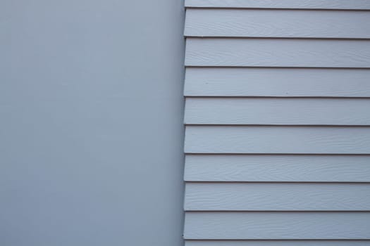 Vintage gray cement wall with half smooth and step texture