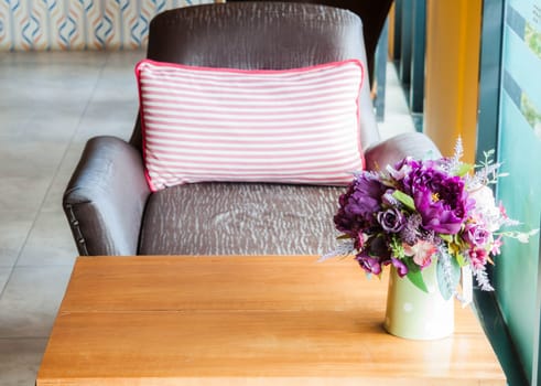 Beautiful plastic flowers in the living room