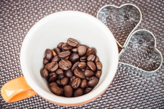 Mug cup of coffee grain on a grunge background