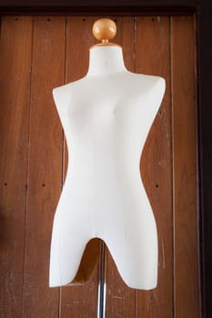 Sepia clothing mannequin display on vintage background