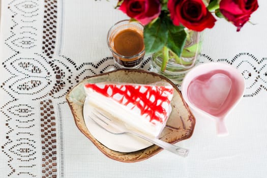 Romantic coffee and cake on white lace table