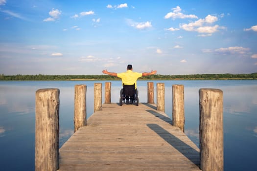 Wheelchair users in summer at the lake