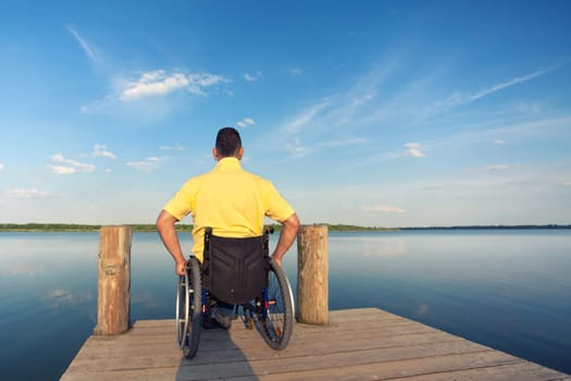 Wheelchair users in summer at the lake