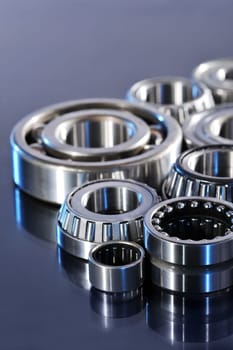 Close-up of various ball bearings in blue light