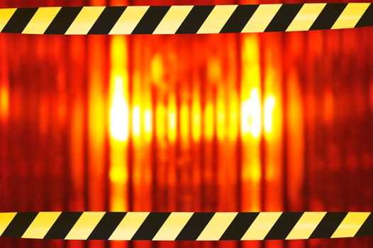 Construction site background with macro detail of an orange all-round light and two original shut-off strips