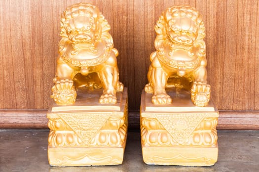 Chinese style figurine couple golden singha