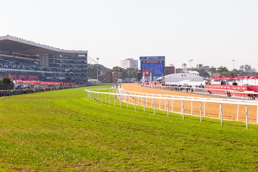 Horse racing action of jockeys races at Greyville racecouse sand and grass for Durban July vodacom cup.