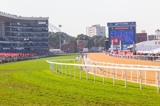 Horse racing action of jockeys races at Greyville racecouse sand and grass for Durban July vodacom cup.