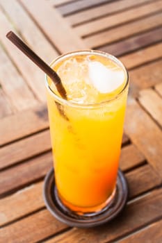 Fresh orange juice with heart ice cube