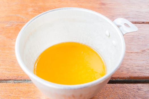 Bakery melt butter measured in plastic  cup
