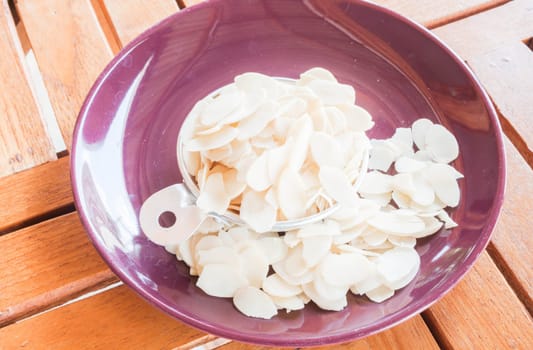 Bakery raw sliced almonds in measured cup