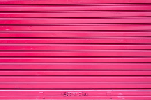 Red roller metal door surface of apartment