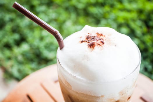 Refreshing glass of cold espresso with micro foam