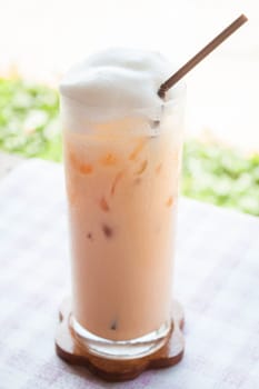 A glass of iced thai milk tea