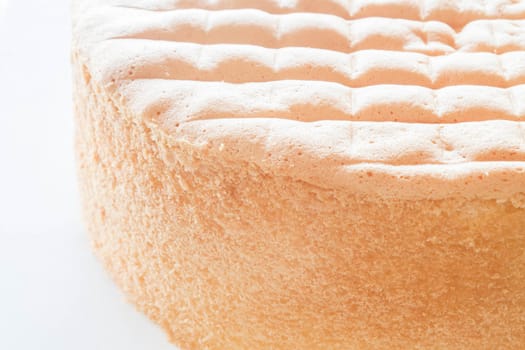 Vanilla sponge cake base for decoration on white background
