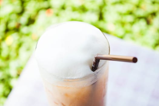 Iced thai milk tea with milk foam