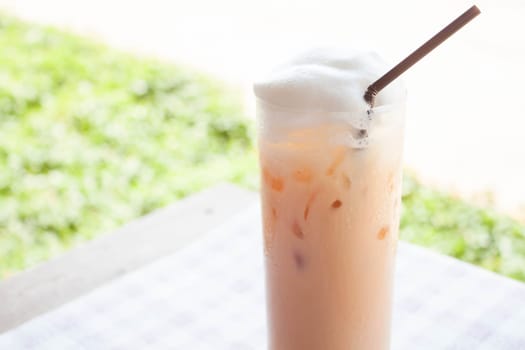 Fresh glass of iced thai milk tea