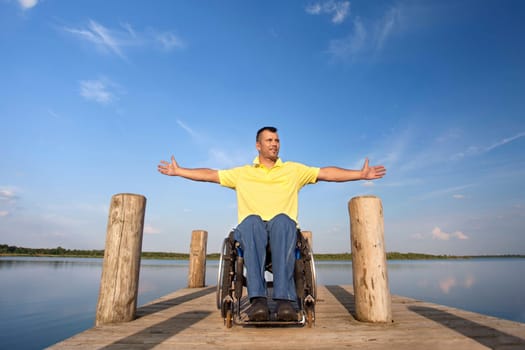 Wheelchair users in summer at the lake