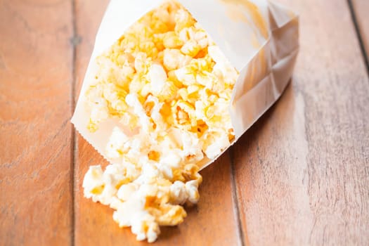 Popcorn pack opened with corn spilling out