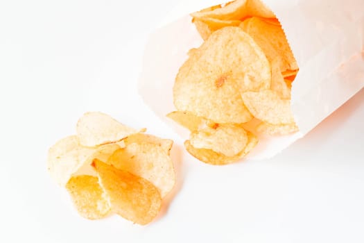 Potato chips snack falling out of the pack