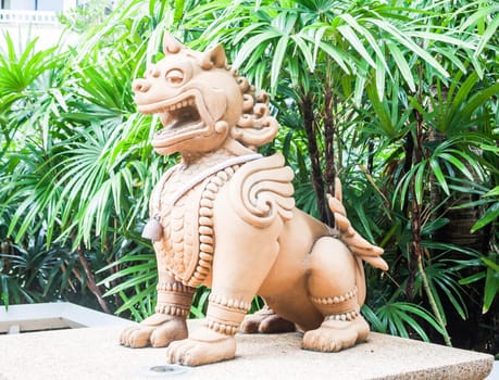 Stone sculpture of lion in tale located in resort