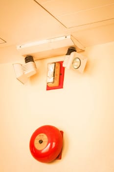 Red fire alarm bell in the building