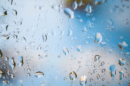 Behind the mirror of rain drops background