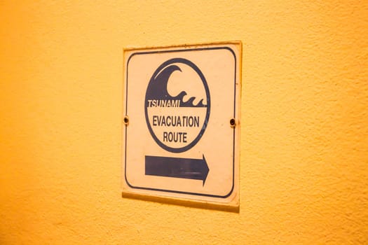 Tsunami evacuation route sign on up stair way