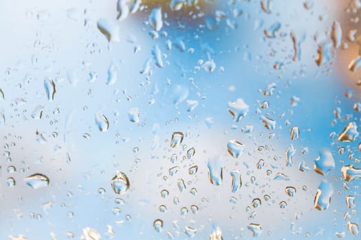 Veritable rain drops behind the window mirror