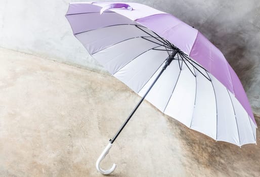 Purple silver bronze uv protection umbrella on the floor