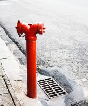 Red metallic fire hydrant on the street