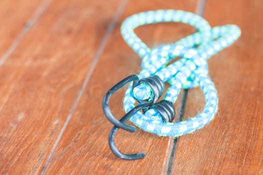 Light blue elastic rope with metal hooks