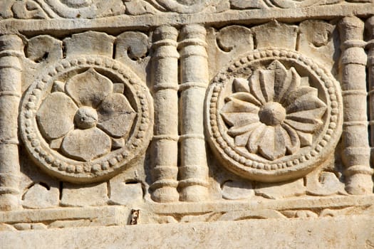 Beautiful stone carving of flower petals on wall of Jagadeesh Temple, Udaipur, Rajasthan, India, Asia