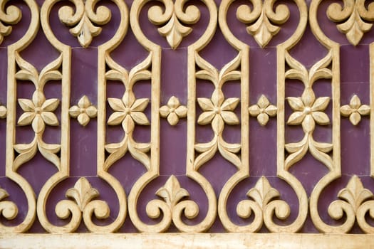 Lovely pattern containing geometrical and floral design on wall at City Palace, Udaipur, Rajasthan, India, Asia