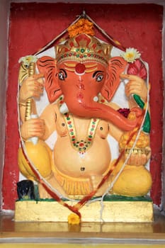 Statue of Ganesha painted pink and red at City Palace, Udaipur, Rajasthan, India, Asia