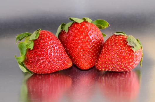 Fresh Ripe Strawberry Fruit on a Colored Background