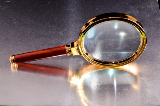 Vintage Magnify Glass Loupe on a Colored Background