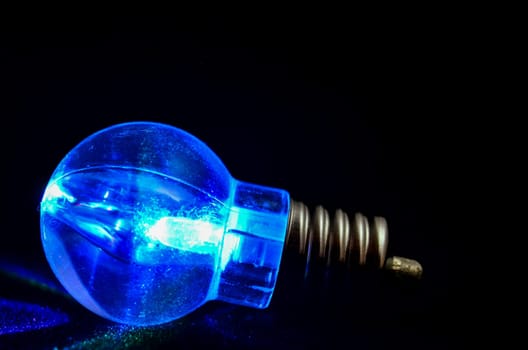 Photo of an Illuminated Light Bulb on Black Background