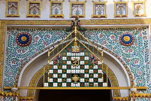 Beautifully painted door top floral design at City Palace, Udaipur, Rajasthan, India, Asia