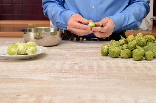 Cutting some sprouts in a kitchen