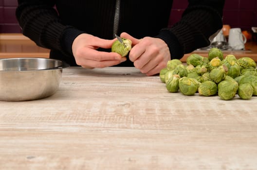 Cutting some sprouts in a kitchen