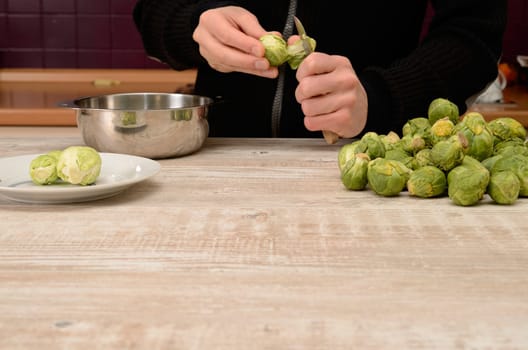 Cutting some sprouts in a kitchen