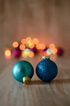 Christmas baubles on a rustic wooden background