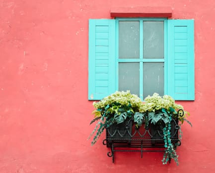 Window on the red wall with copy space