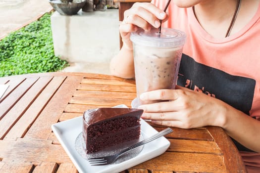Coffee break with iced coffee and chocolate cake